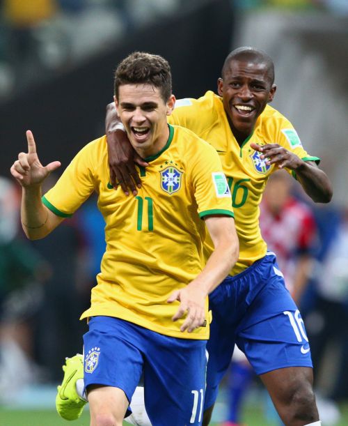 Oscar (left) celebrates his goal with Ramires.