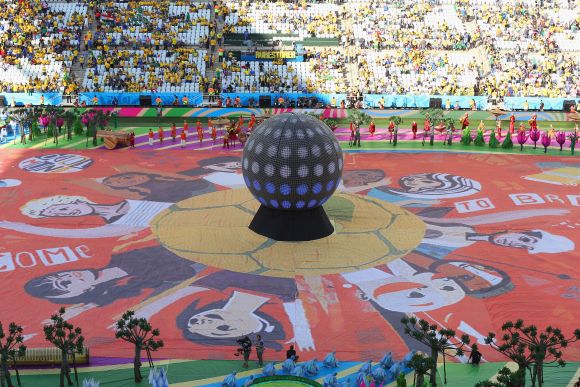 The Happiness Flag is seen as artists perform during the Opening Ceremony of the 2014 FIFA World Cup Brazil