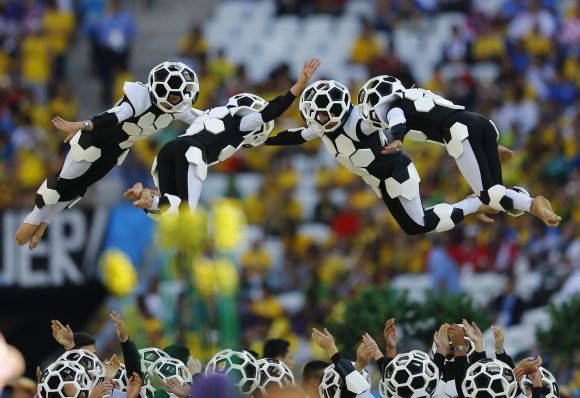 Performers are thrown into the air during the 2014 World Cup opening ceremony.