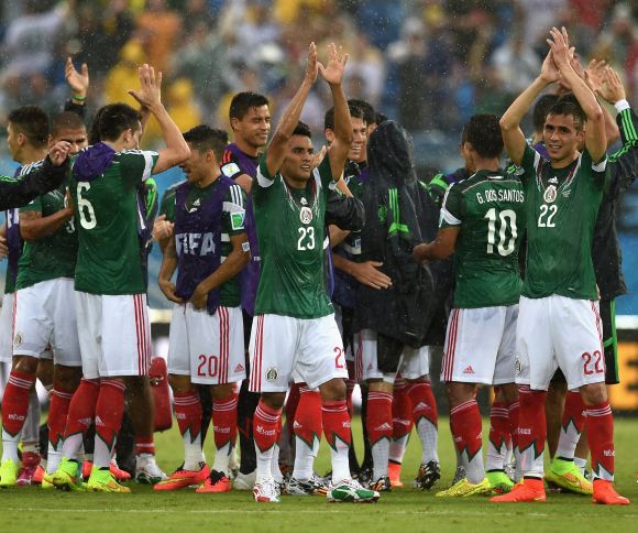 Mexican players celebrate after winning the game