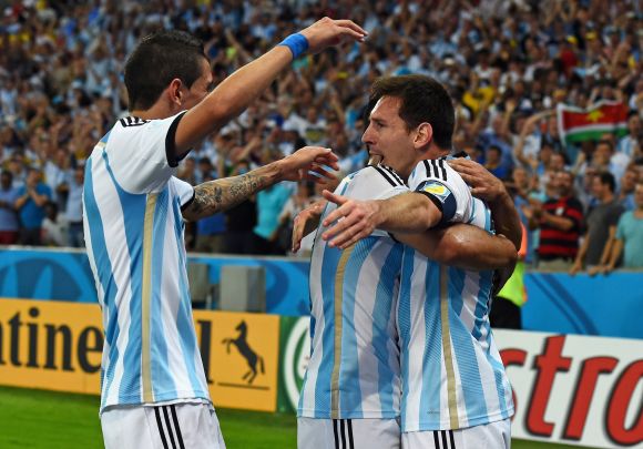 Lionel Messi of Argentina (right) celebrates scoring his team's second goal with teammates