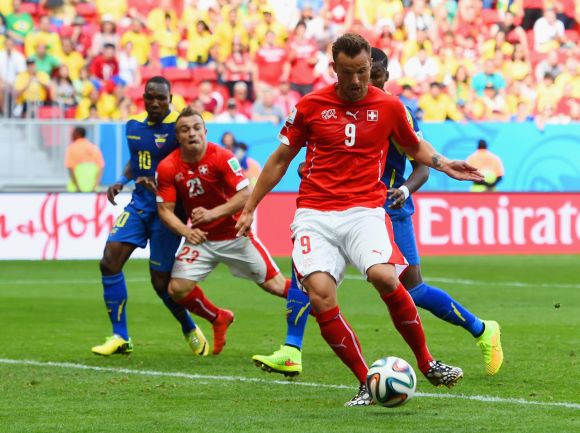 Haris Seferovic of Switzerland shoots and scores his team's second goal