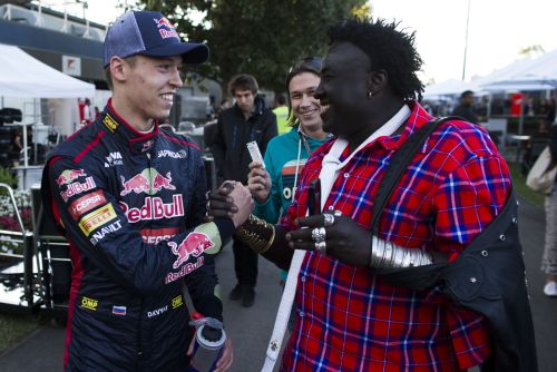 Daniil Kvyat of Russia and Scuderia Toro Rosso is congratulated after finishing tenth