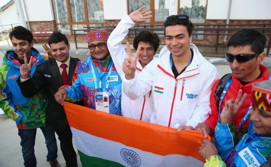 Indian athletes Shiva Keshavan and Himanshu Thakur pose for a photo during the welcome ceremony and flag raising at the mountain athletes village