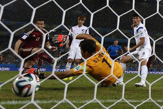 Russia's Alexander Kerzhakov scores a goal against South Korea during their 2014 World Cup 