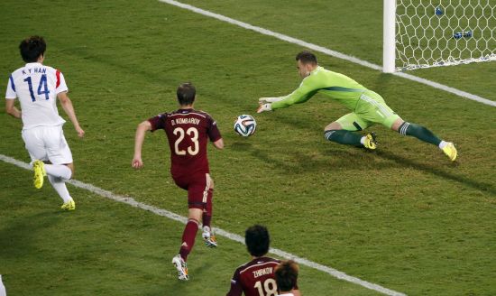 Russia's goalkeeper Igor Akinfeev makes a save 