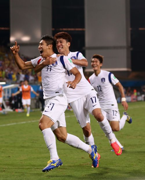 Lee Keun-Ho of South Korea (L) celebrates scoring his team's first goal