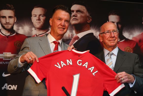 Louis van Gaal appears at a press conference with Sir Bobby Charlton as he is unveiled as the new Manchester United manager at Old Trafford 