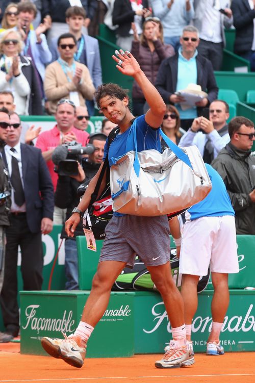 Rafael Nadal of Spain walks off court after losing in his match against David Ferrer 