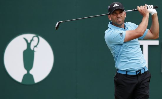 Sergio Garcia of Spain watches his tee shot on the first hole 