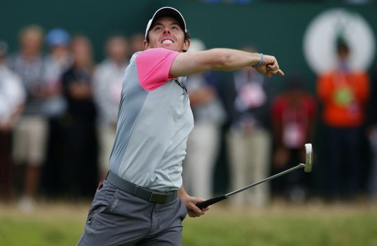Rory McIlroy of Northern Ireland celebrates on the 18th green after winning the British Open Championship 