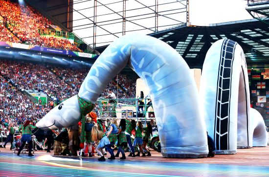 Dancers perform with a Loch Ness Monster during the Opening Ceremony for the Glasgow 2014 Commonwealth Games at Celtic Park