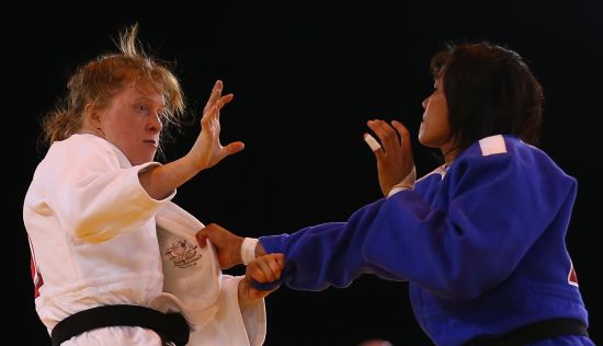 Catherine Arscott of Australia (white) competes againsts Sunibala Huidrom of India in the Judo 70kg at SECC Precinct during day two of the Glasgow 2014 Commonwealth Games 