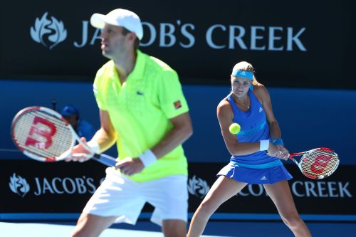 Kristina Mladenovic plays a backhand in her mixed doubles final match with Daniel Nestor against Sania Mirza and Horia Tecau