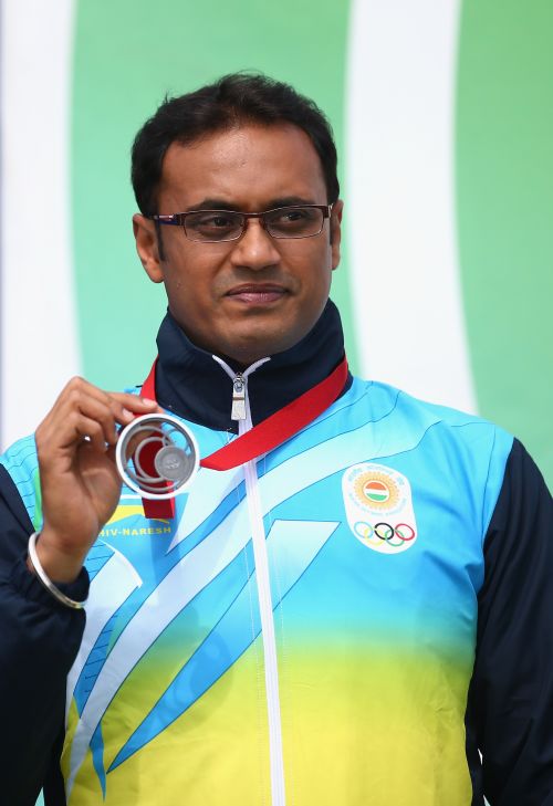 Prakash Nanjappa of India celebrates winning the Silver Medal in the Men's 10m Air Pistol Shooting 