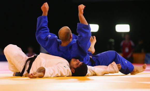 Jake Andrewartha of Australia competes against Parikshit Kumar of India in the Mens +100kg Judo bronze medal contest