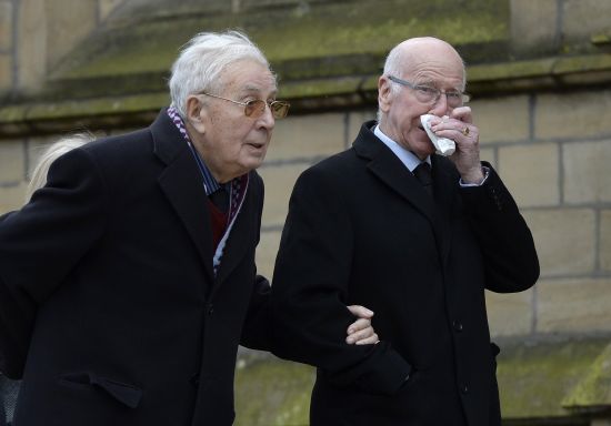 Doug Ellis (L) and Bobby Charlton arrive for the funeral of former Preston and England soccer player Tom Finney at Preston Minster