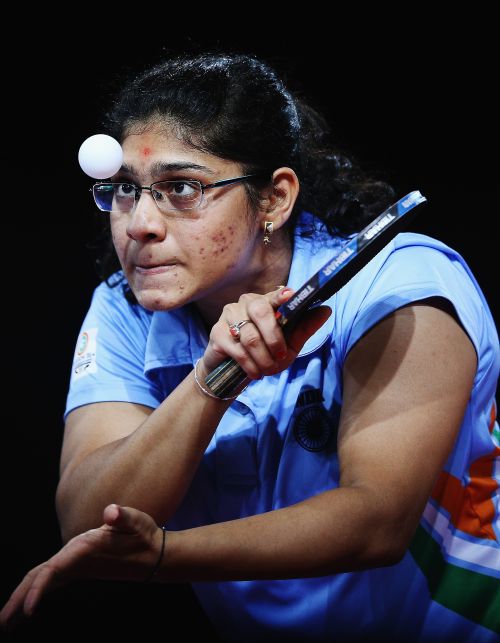 Madhurikaa Paatkar of India serves against Ziyu Zhang of Australia during the Women's Team bronze medal match 