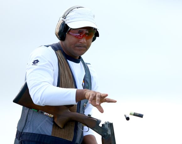 Asab Mohd of India in action during the Men's Double Trap final at Barry Buddon Shooting Centre