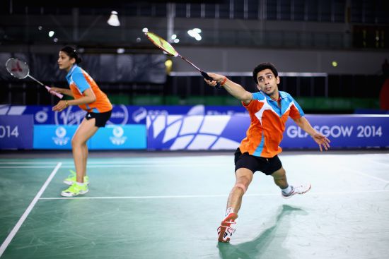 R V Gurusaidutt (r) and Ashwini Ponnappa of India in action in thier mixed doubles match against Danny Chrisnanta and Vanessa Neo of Singapore in the Mixed Team Bronze medal final 