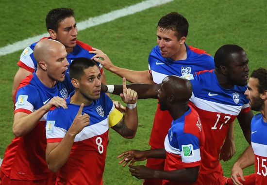 Clint Dempsey of the United States celebrates with teammates after scoring his team's first goal 
