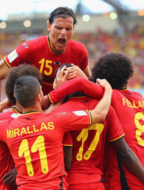 Divock Origi of Belgium (center) celebrates scoring his team's first goal