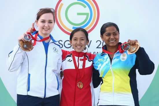 old medalist Jasmine Ser of Singapore, Jen McIntosh of Scotland and Bronze medalist Lajja Gauswami of India after the 50m Rifle 3 positions final at Barry Buddon Shooting Centre