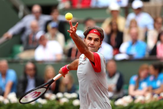 Roger Federer of Switzerland serves during his men's singles match against Dmitry Tursunov of Russia.