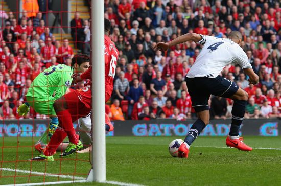 Younes Kaboul of Tottenham Hotspur scores an own goal during the Barclays Premier League match