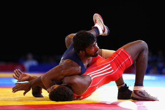 Yogeshwar Dutt of India defeats Chamara Perera of Sri Lanka in the semi-final of the 65kg men's Wrestling at Scottish Exhibition And Conference Centre