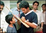 Many young boys wanted their bats autographed by the master