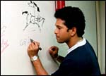 Sachin autographs the Rediff wall featuring other Chat guests