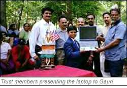 Gaurishankar receiving a laptop from Mr. Udayabhanu, Chairman, Sree Narayana Association