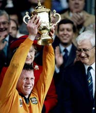 Australian captain Nick Farr-Jones lifts the trophy after their victory in the World Cup final against England