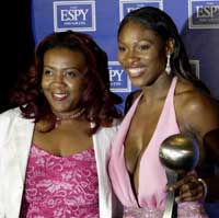 Yetunde Price with Serena Williams. Pic: Reuters