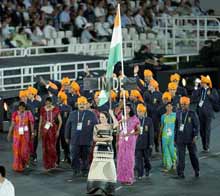 Flag bearer Anju Bobby George leads the Indian team
