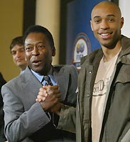 Pele (left) shakes hands with Thierry Henry during a press conference announcing the 100 greatest football players in London