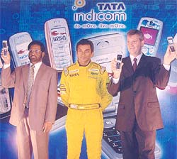 Narain Karthikeyan (centre) at the launch of Tata Indicom-Nokia mobile handsets