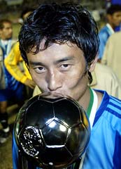 Indian football captain Baichung Bhutia kisses the SAFF Cup