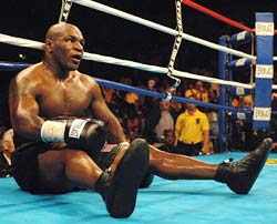Mike Tyson hits the canvas after being knocked down by Kevin McBride