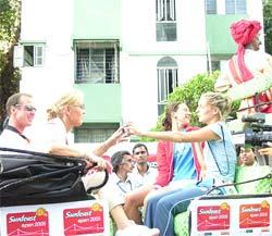 Players participating in the Sunfeast Open enjoying a buggy ride on the streets of Kolkata