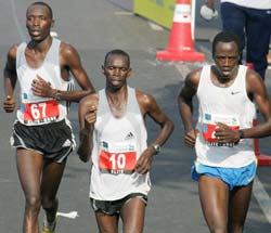 Kenyan runners Stanley Lelieto, (L), Daniel Rono (C) and Desse Mandago Kipkorir