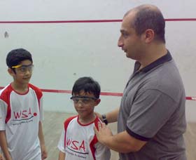 Adrian Ezra with young squash players