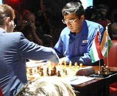 Anand on the board against Peter Leko in 14th and final round at World Chess Championships