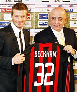 David Beckham with AC Milan's vice president Adriano Galliani during his presentation in Milan