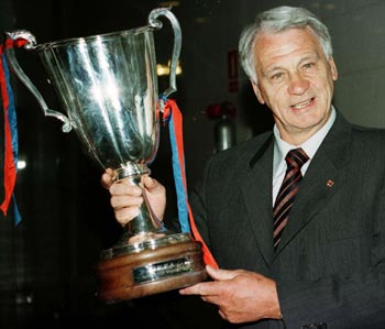 Barcelona's British coach Bobby Robson is seen posing with the Cup Winners' Cup trophy on May 15, 1997.