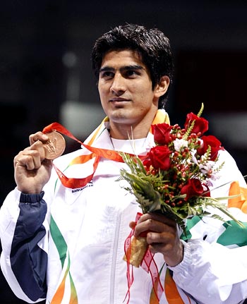 Vijender Kumar shows off the bronze medal during the medal ceremony at the Beijing 2008 Olympic Games