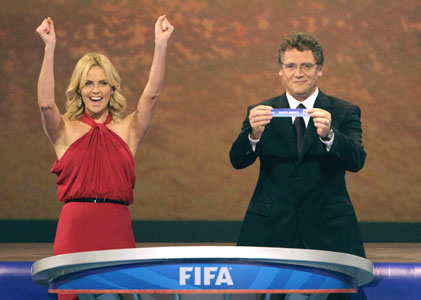 South African actress Charlize Theron cheers as FIFA general secretary Valcke announces the name of South Africa during the World Cup draw on Friday