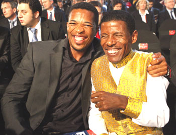 South African cricketer Makhaya Ntini (left) and Ethiopian runner Haile Gebrselassie shares a laugh before the 2010 World Cup draw in Cape Town on Friday