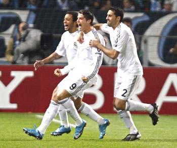 Real Madrid's Ronaldo (centre) celebrates with team-mates after scoring against Olympique Marseille